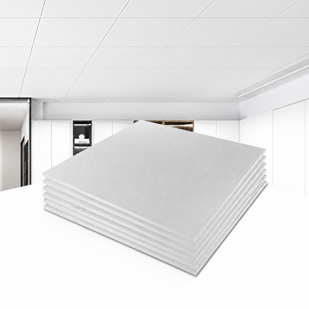 Stack of white ceiling panels in a room with white ceiling and walls