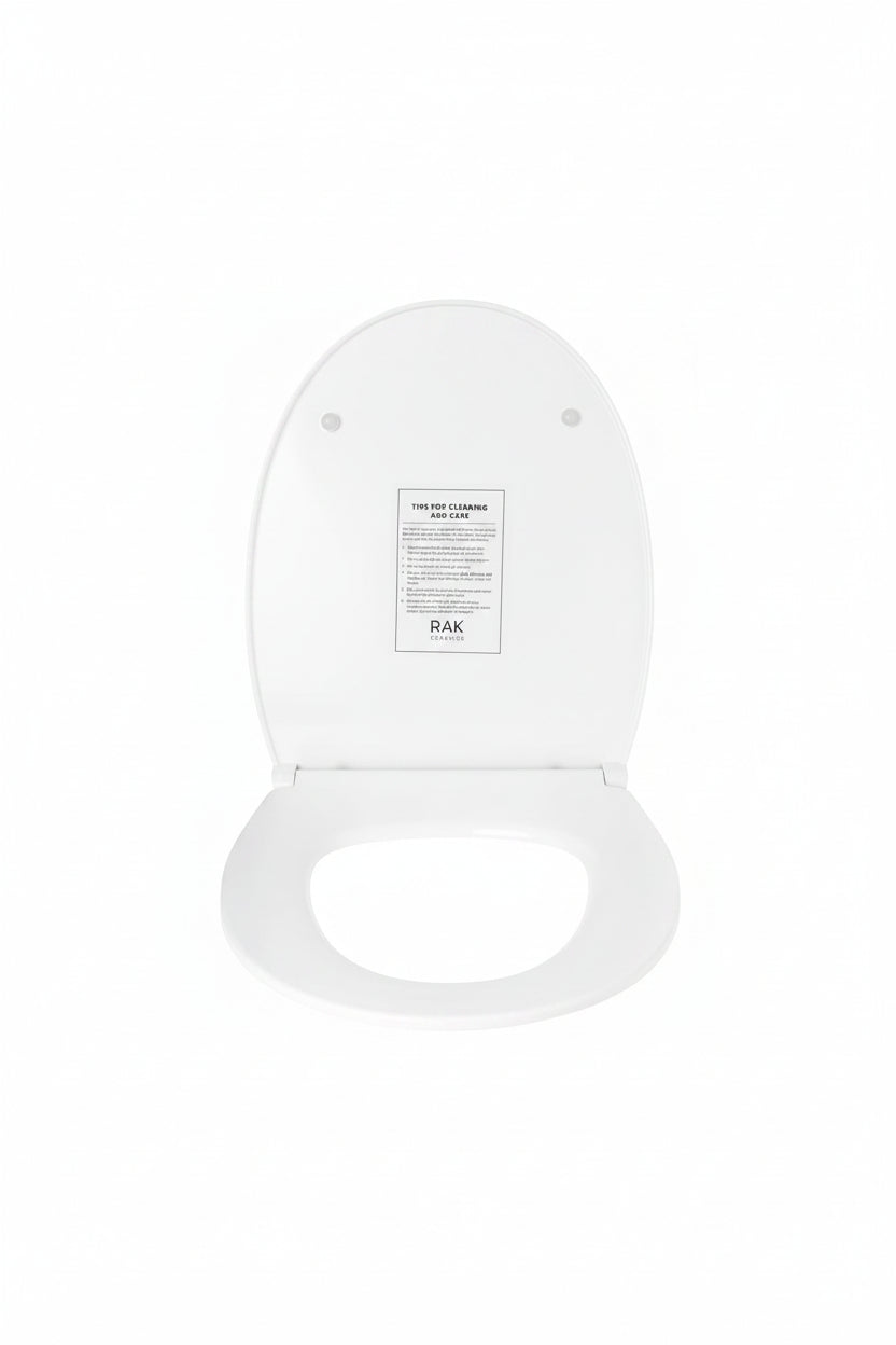 A white toilet seat lid shown open against a white background, with a small instruction card labeled RAK 