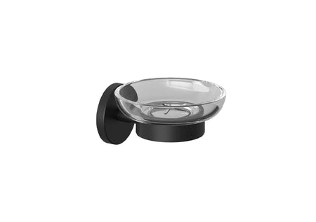 A wall-mounted soap dish with a clear glass bowl and a matte black base and backplate.